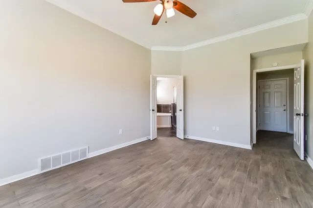 a view of an empty room with a window