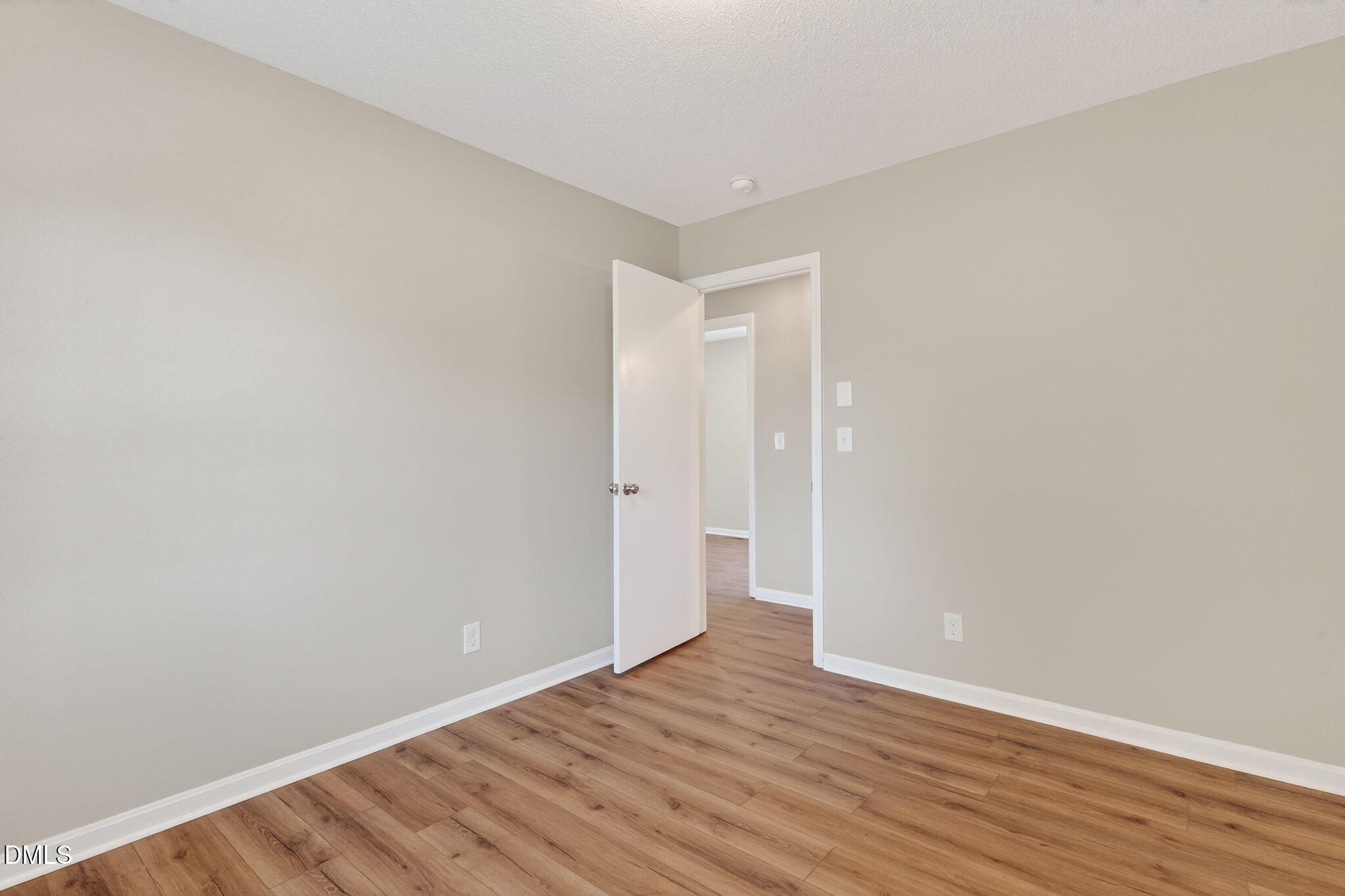 6086 Red Hill Church Road Coats, NC 27521 - Photo 26 of 44 a view of an empty room with wooden floor