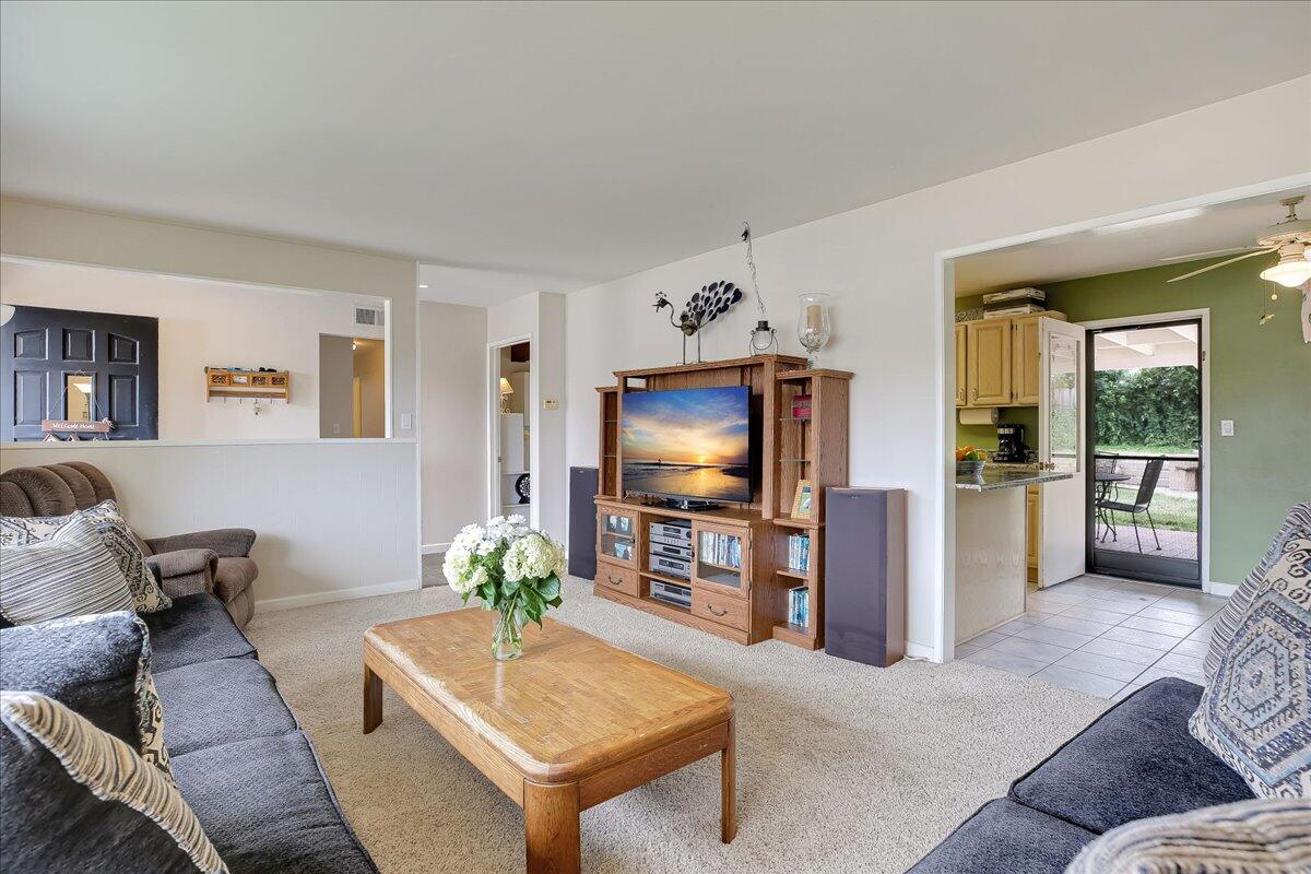 77 Newcastle Circle Goleta, CA 93117 - Photo 15 of 34 a living room with furniture and a flat screen tv