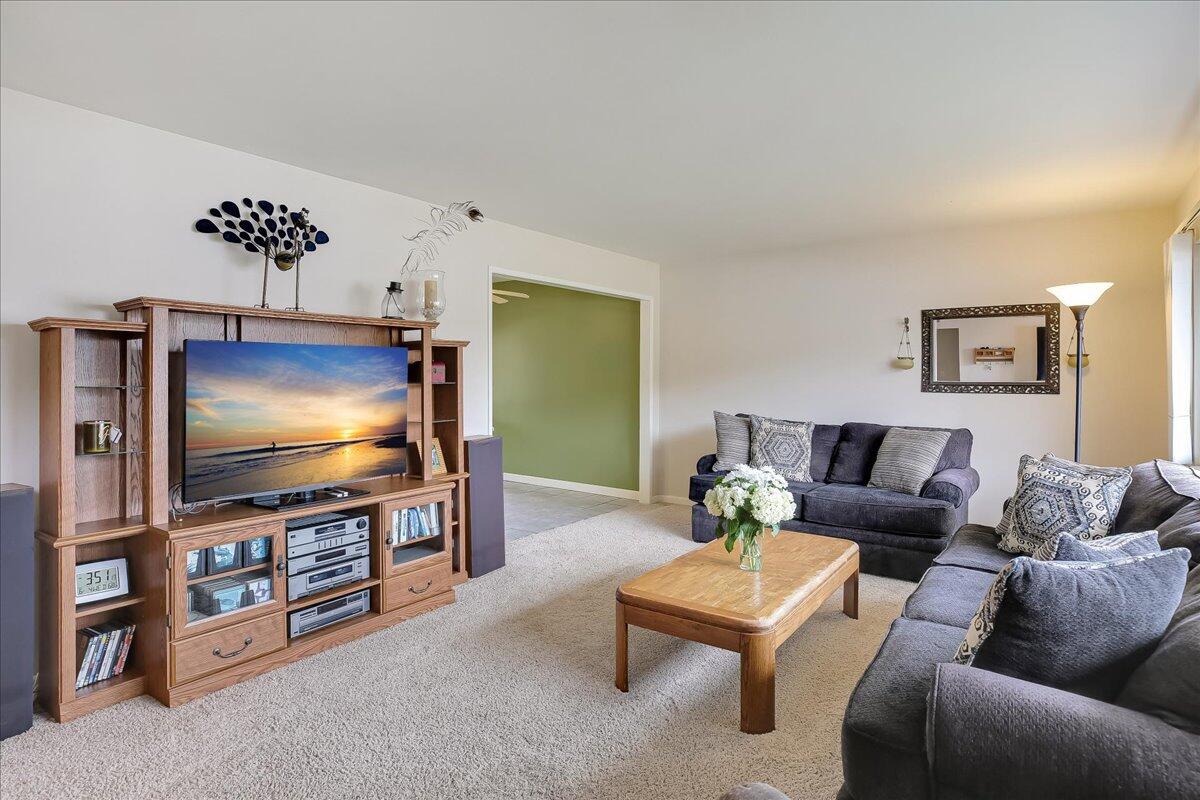 77 Newcastle Circle Goleta, CA 93117 - Photo 16 of 34 a living room with furniture and a flat screen tv