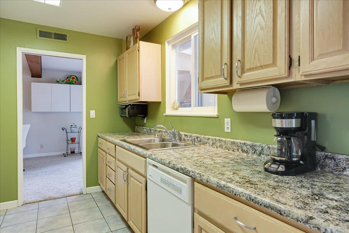 77 Newcastle Circle Goleta, CA 93117 - Photo 22 of 34 a kitchen with sink and cabinets