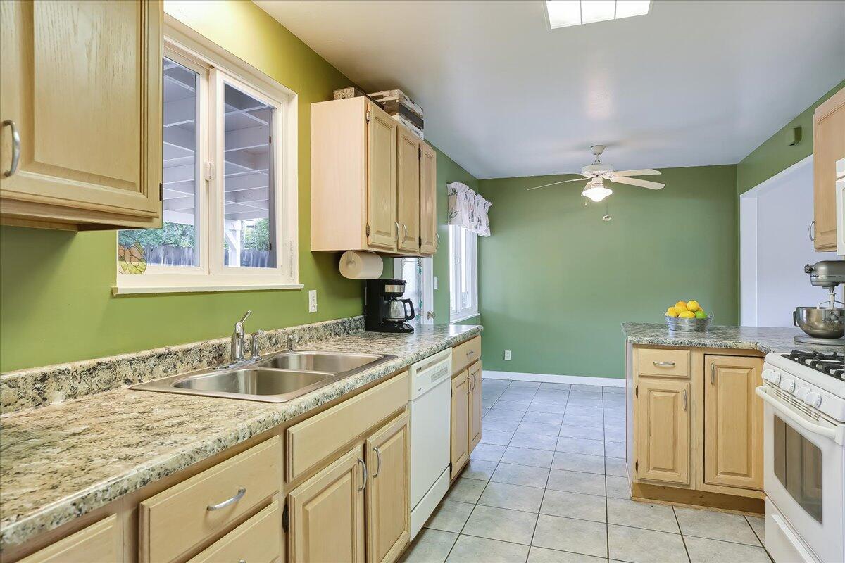 77 Newcastle Circle Goleta, CA 93117 - Photo 23 of 34 a kitchen with a sink and cabinets