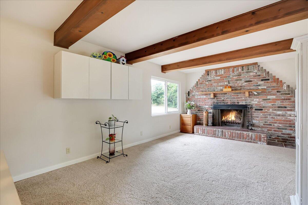 77 Newcastle Circle Goleta, CA 93117 - Photo 25 of 34 a view of an empty room with a fireplace and a window