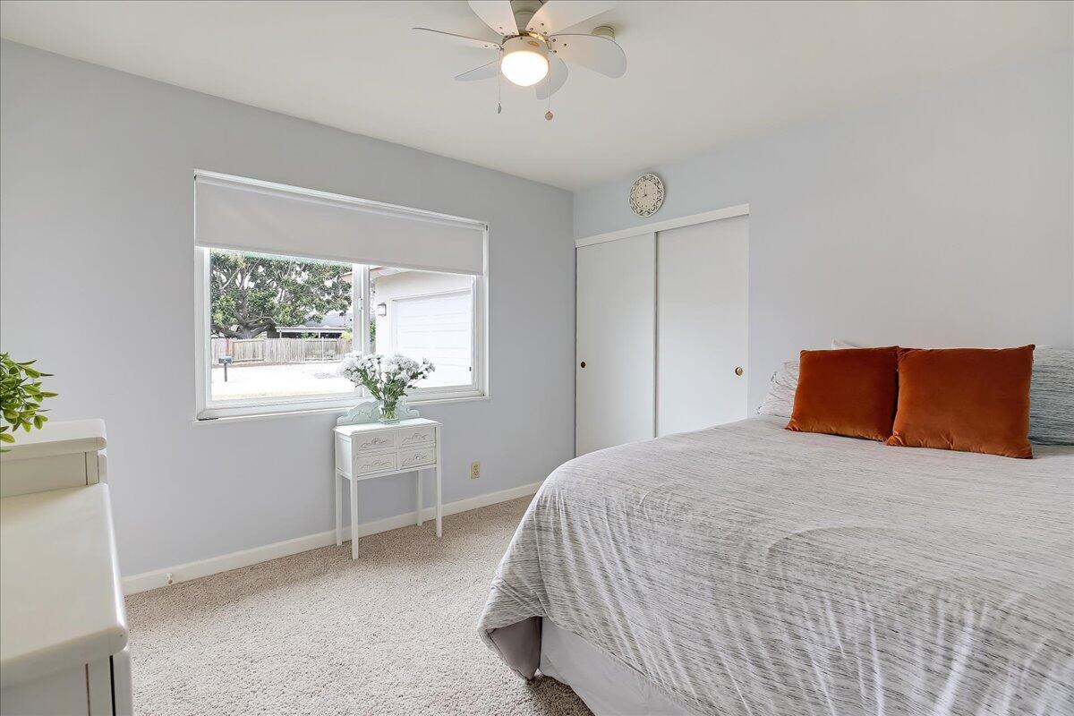 77 Newcastle Circle Goleta, CA 93117 - Photo 28 of 34 a bedroom with a bed and a table in it