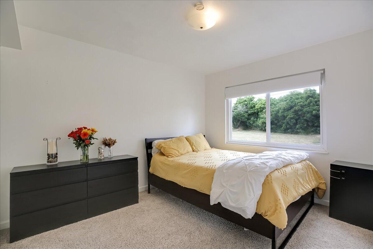 77 Newcastle Circle Goleta, CA 93117 - Photo 30 of 34 a bedroom with a bed and a window