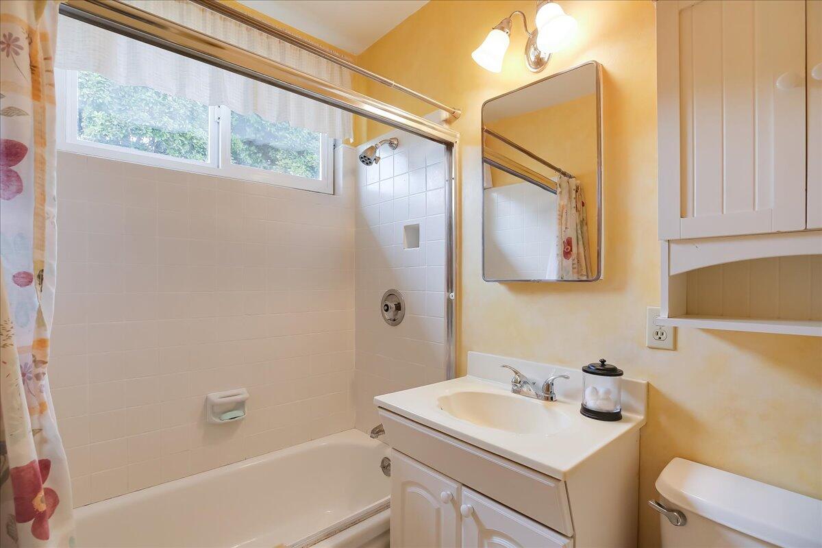 77 Newcastle Circle Goleta, CA 93117 - Photo 31 of 34 a bathroom with a sink toilet and vanity