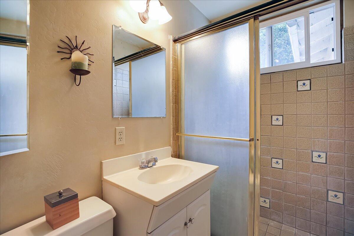 77 Newcastle Circle Goleta, CA 93117 - Photo 32 of 34 a bathroom with a sink a toilet and mirror