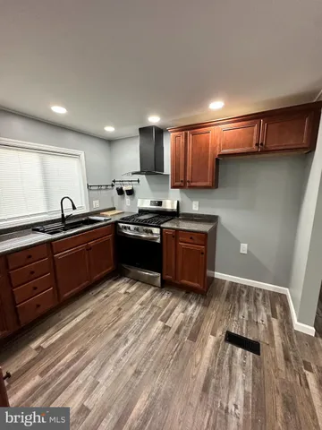 a kitchen with stainless steel appliances granite countertop a sink counter space and cabinets