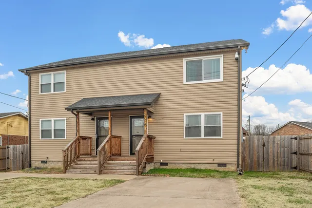 a front view of a house with garage