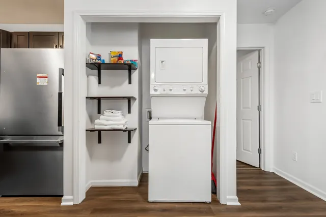 a room with a refrigerator and cabinets