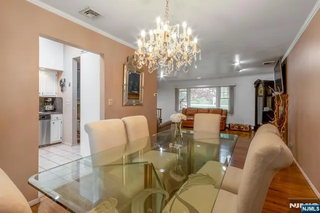 a kitchen with granite countertop cabinets stainless steel appliances and a counter space