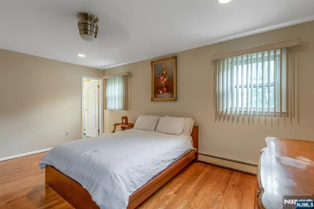 a bathroom with a sink mirror and toilet