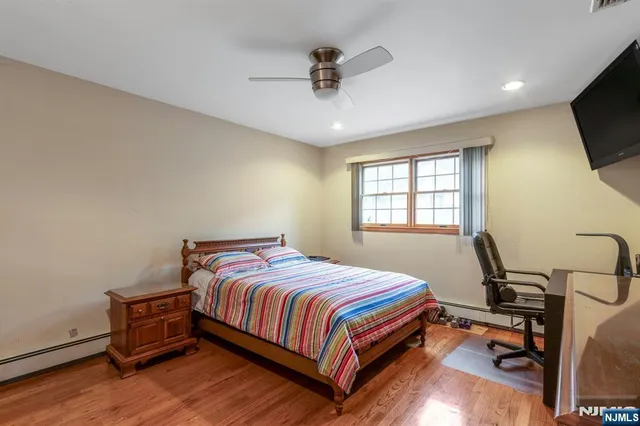 a bedroom with a bed a desk and chair