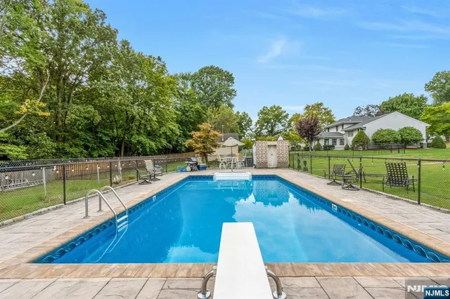 a view of a swimming pool with a patio