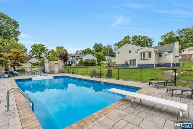 a view of a house with a yard porch and sitting area