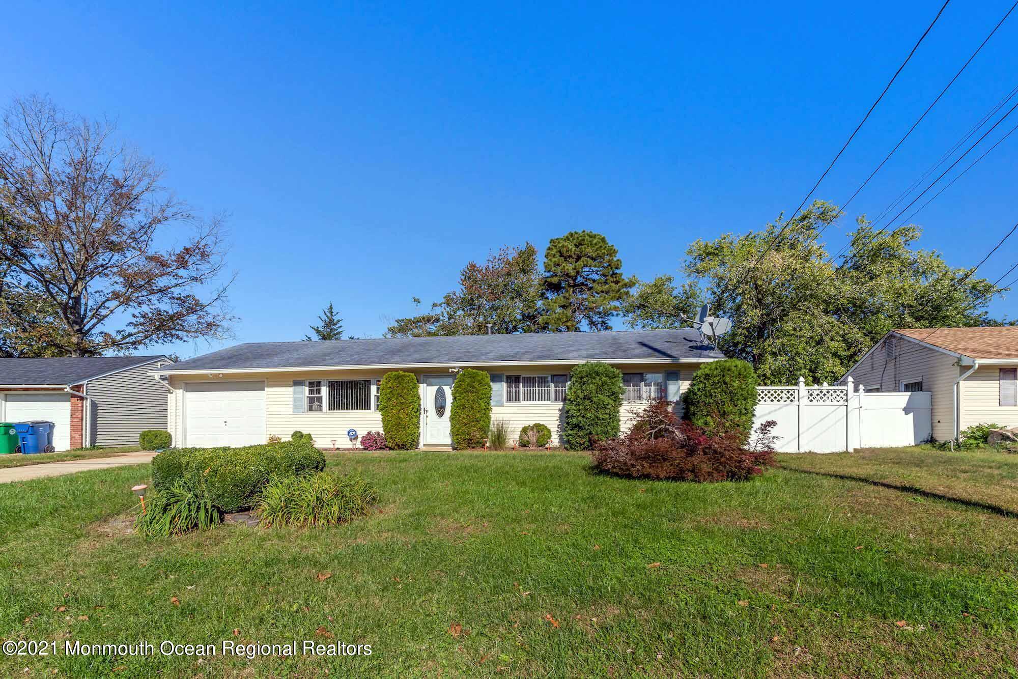 451 Alfred Road Toms River, NJ 08757 - Photo 2 of 25 a front view of a house with a garden