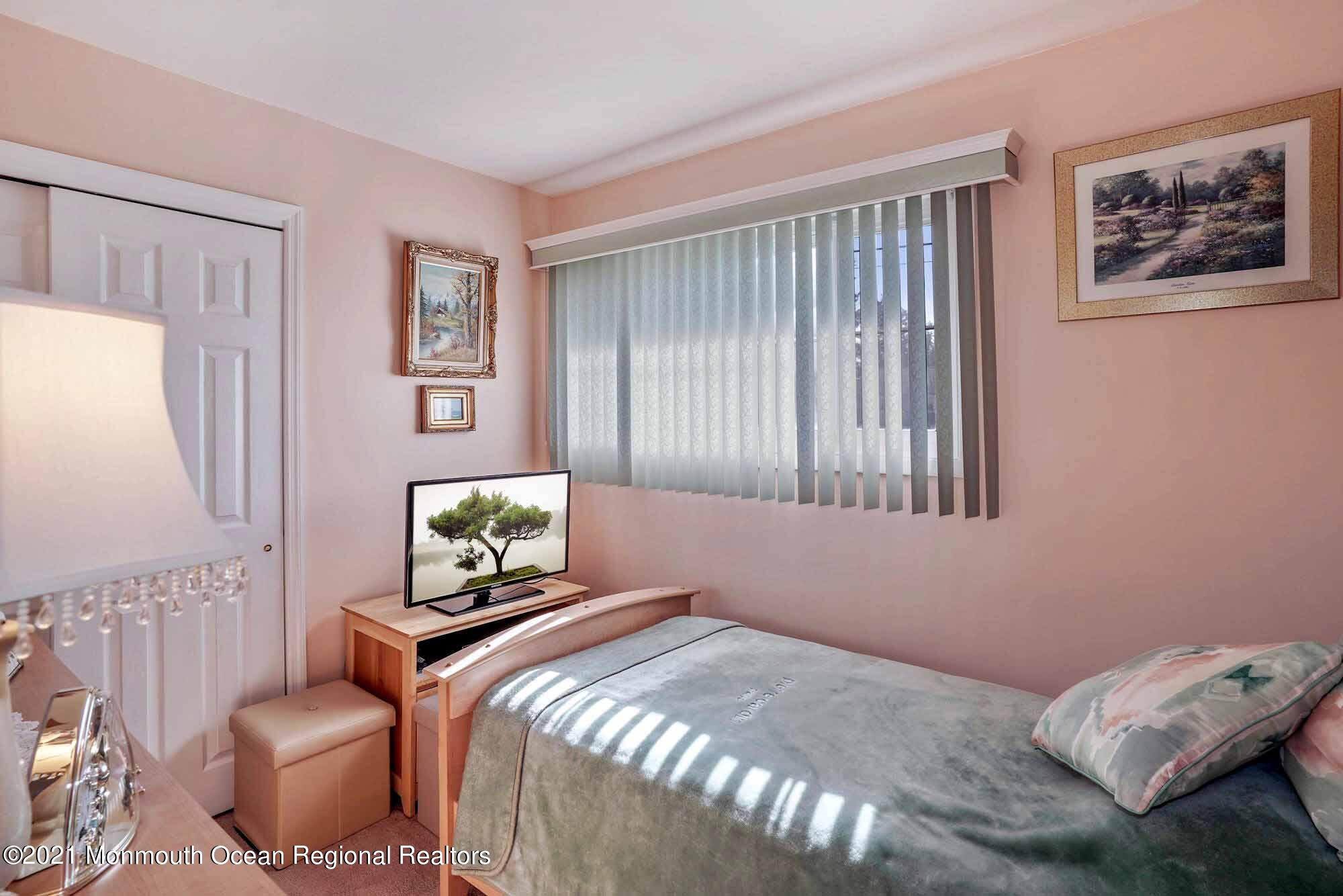451 Alfred Road Toms River, NJ 08757 - Photo 11 of 25 a bedroom with a bed and wooden floor