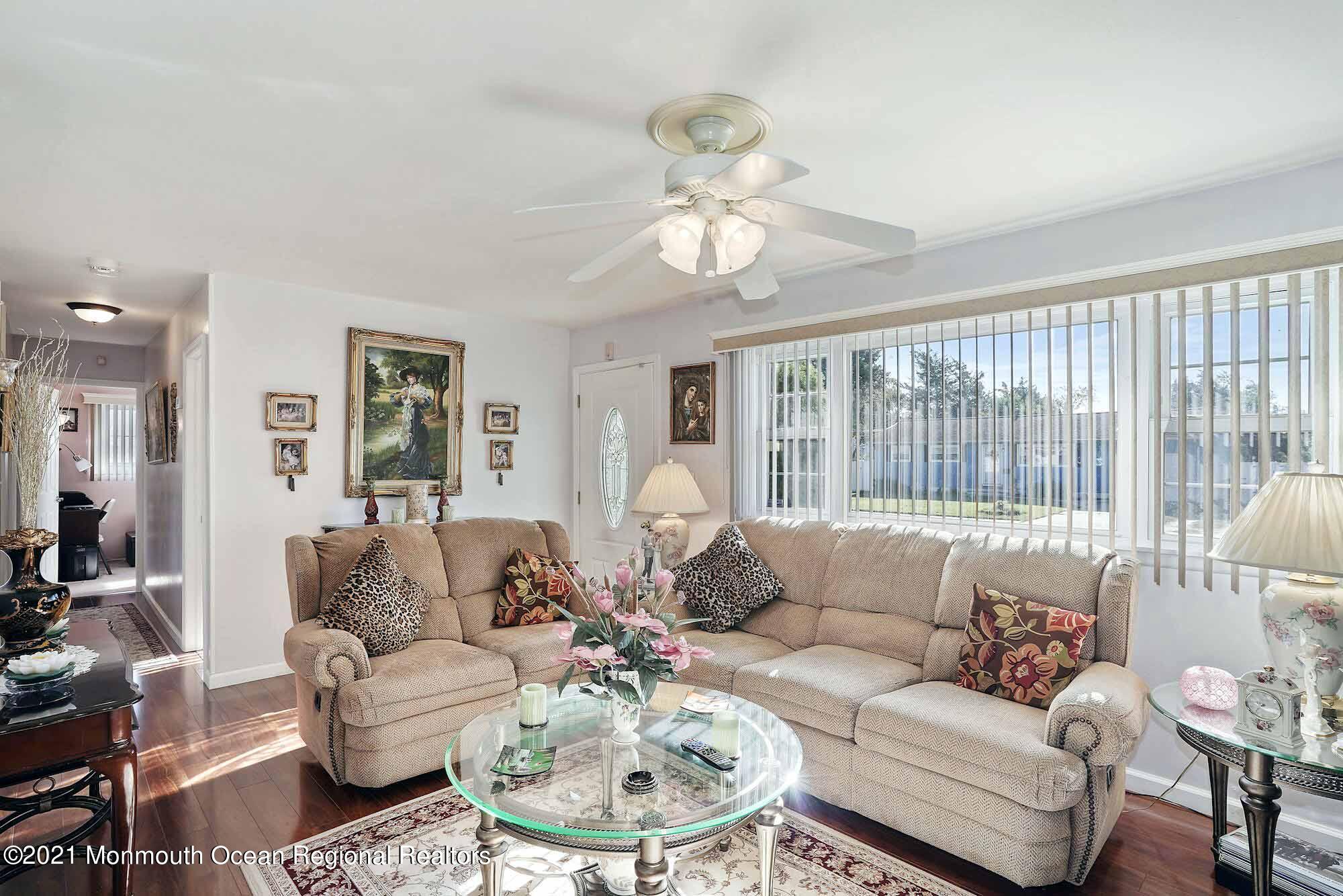 451 Alfred Road Toms River, NJ 08757 - Photo 3 of 25 a living room with furniture a flat screen tv and a large window