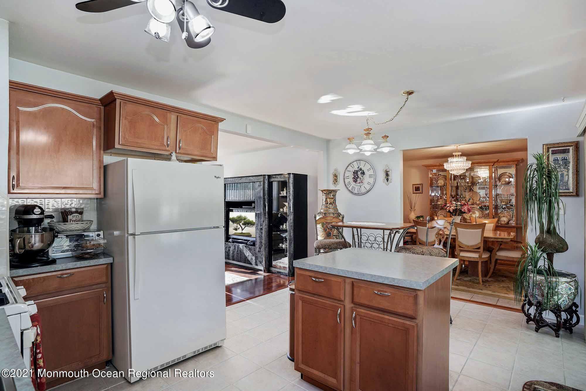 451 Alfred Road Toms River, NJ 08757 - Photo 8 of 25 a kitchen with stainless steel appliances a refrigerator a sink dishwasher stove and refrigerator