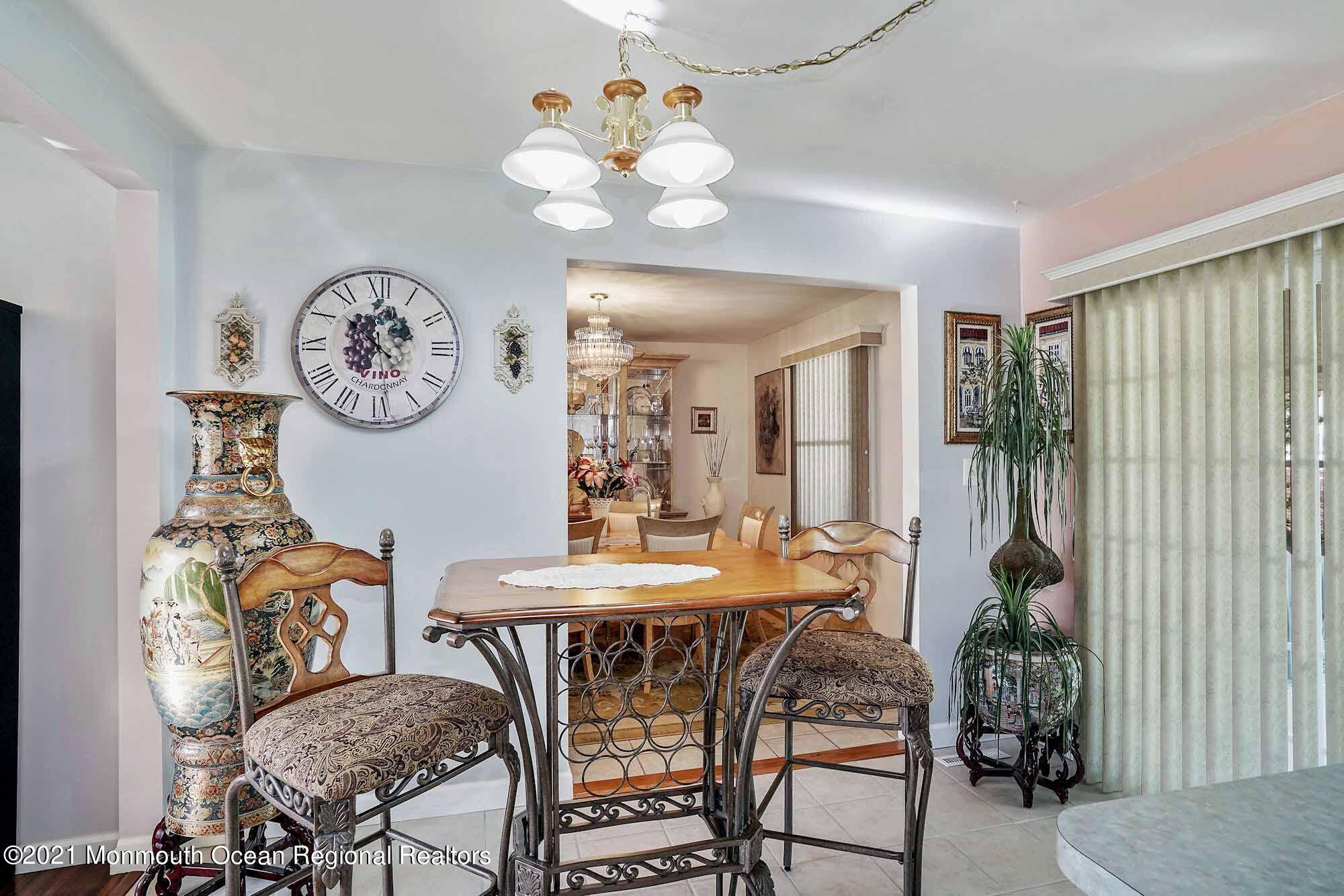 451 Alfred Road Toms River, NJ 08757 - Photo 9 of 25 a view of a dining room with furniture and chandelier