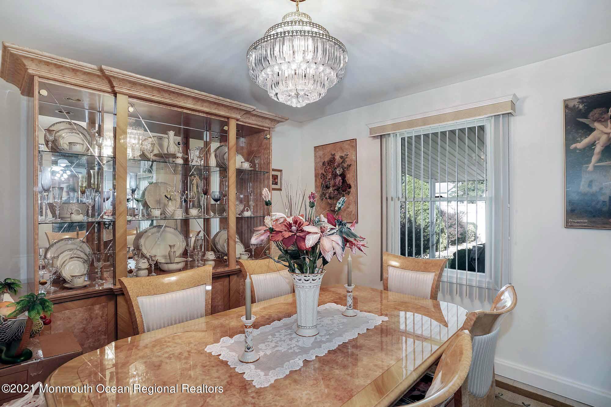 451 Alfred Road Toms River, NJ 08757 - Photo 10 of 25 a dining room with furniture a chandelier and window