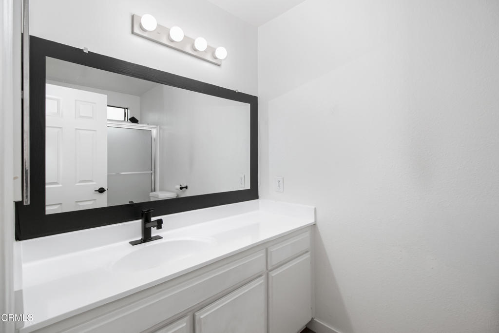1169 Rosedale Avenue, Unit 208 Glendale, CA 91201 - Photo 12 of 20 a bathroom with a sink and a mirror