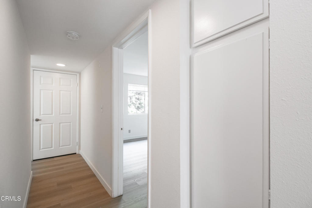 1169 Rosedale Avenue, Unit 208 Glendale, CA 91201 - Photo 6 of 20 a view of a hallway with wooden floor