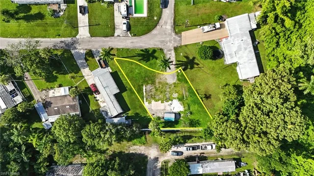 an aerial view of residential house with outdoor space and swimming pool