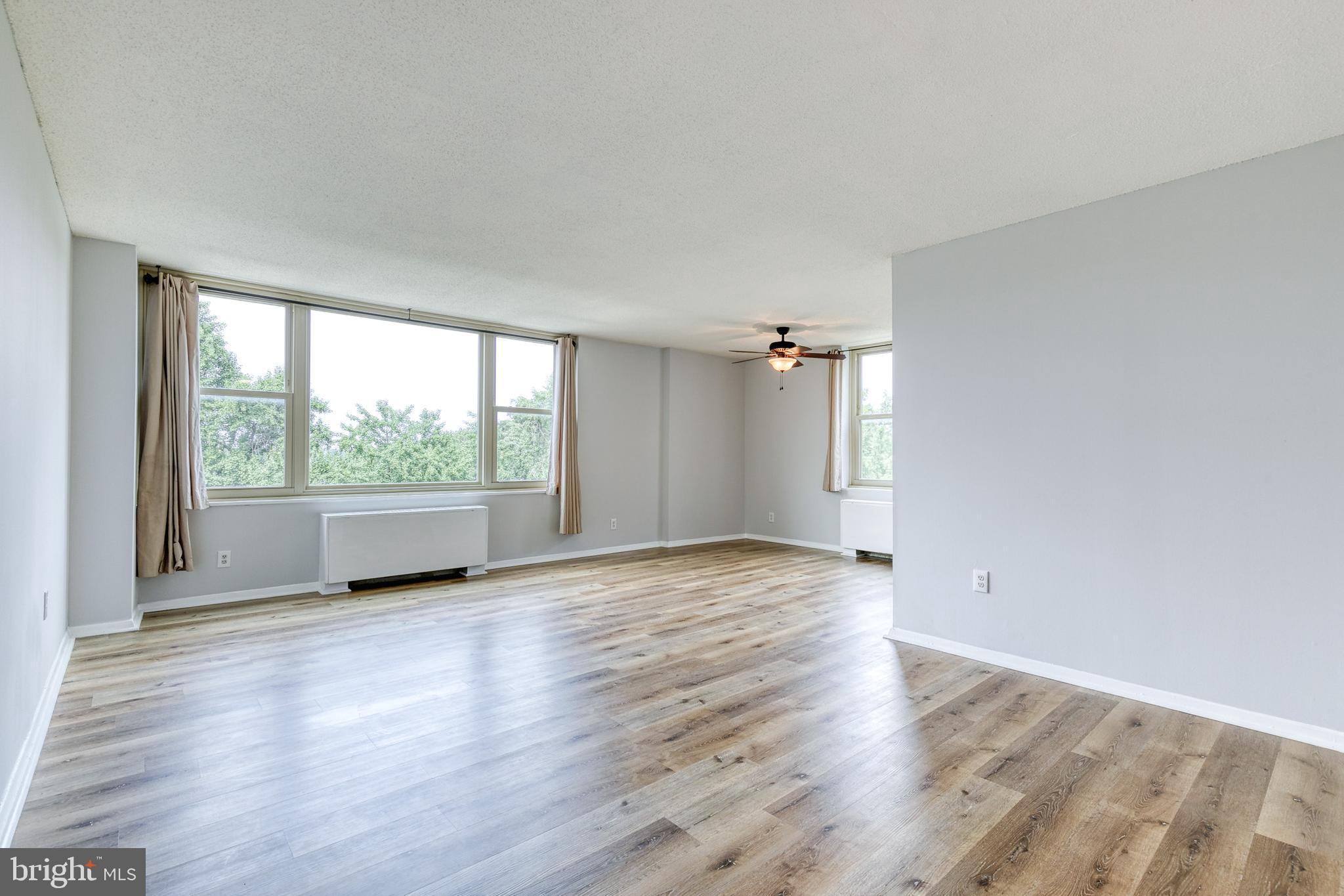4401 Roland Avenue, Unit 408 Baltimore, MD 21210 - Photo 4 of 33 Living Area into Dining Area