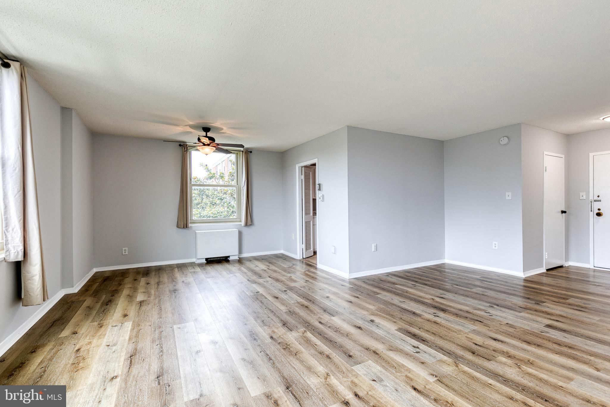 4401 Roland Avenue, Unit 408 Baltimore, MD 21210 - Photo 5 of 33 Living Area into Dining Area