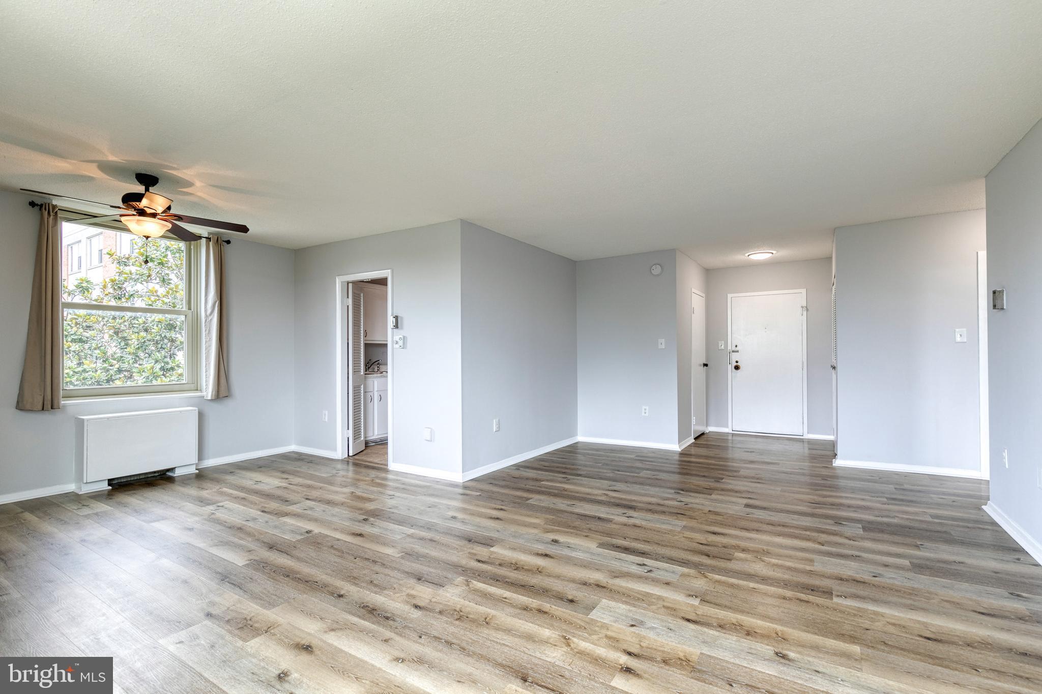 4401 Roland Avenue, Unit 408 Baltimore, MD 21210 - Photo 6 of 33 Living Area into Dining Area