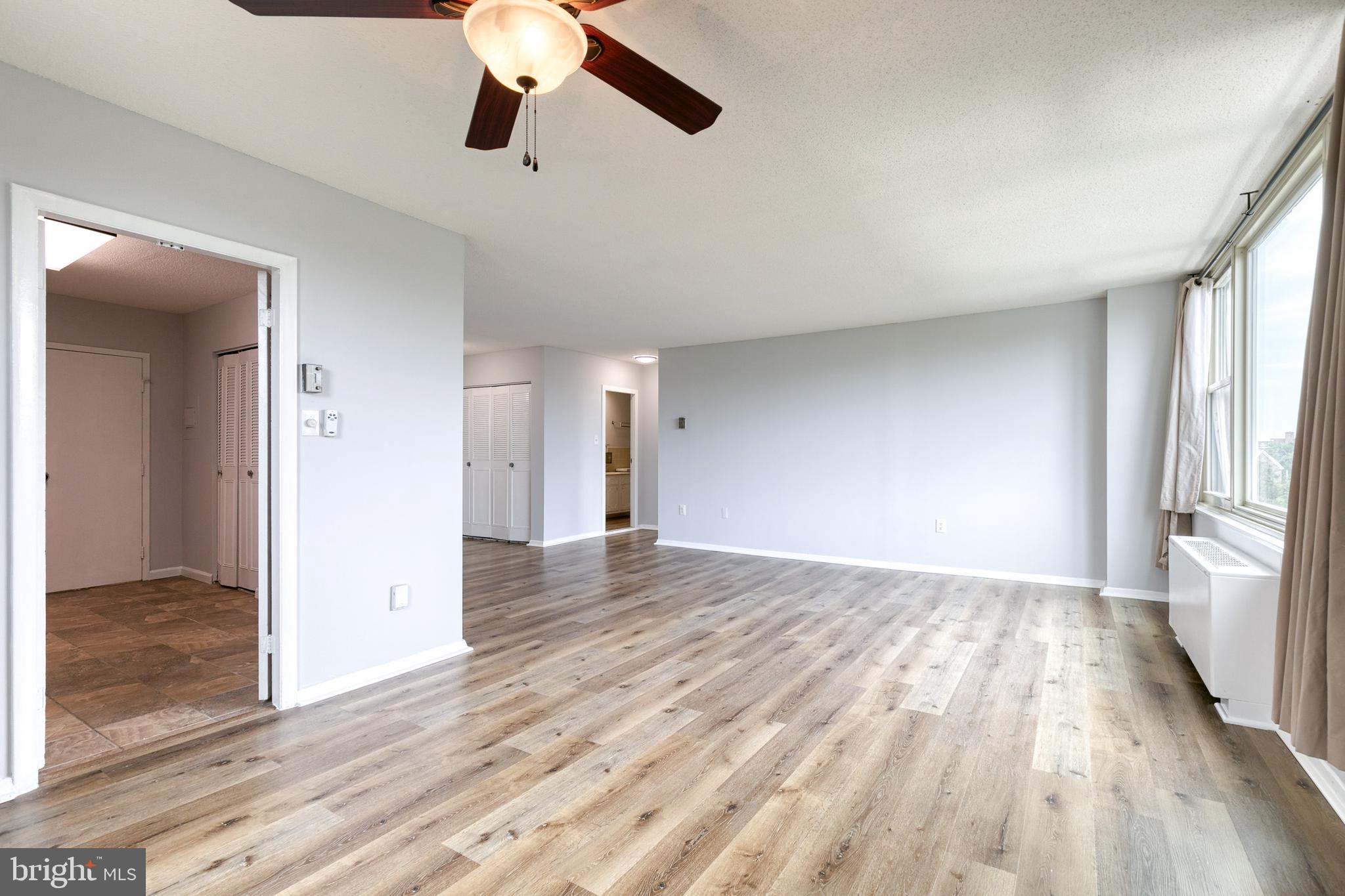 4401 Roland Avenue, Unit 408 Baltimore, MD 21210 - Photo 8 of 33 Dining Area into Living Area