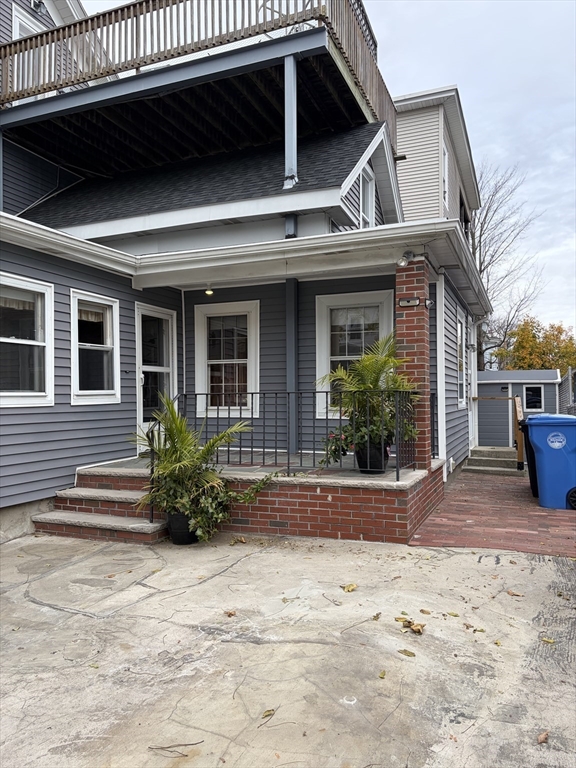 a view of a house with a patio and plants