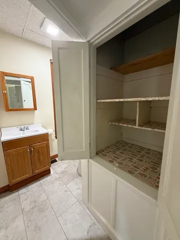 a bathroom with a tub and a shower