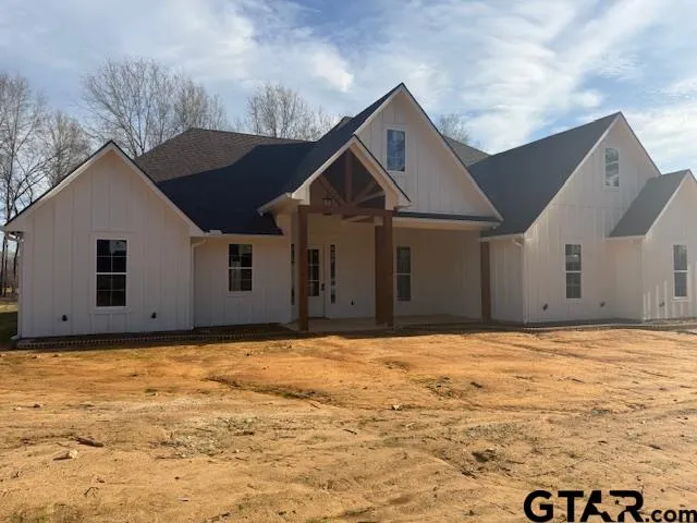 a house with yard in front of it