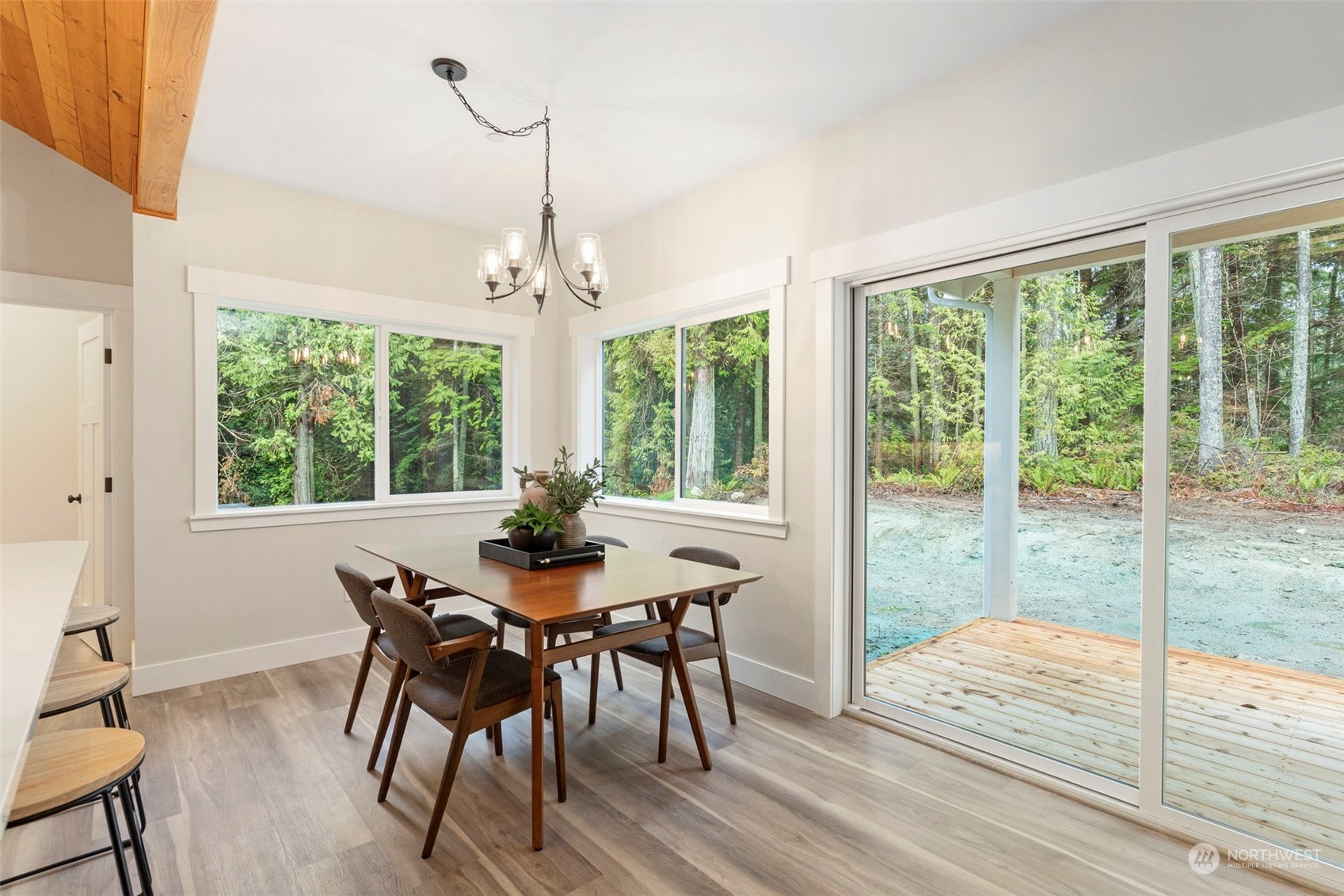 22086 Dewberry Road Northeast Indianola, WA 98342 - Photo 11 of 40 a view of a dining room with furniture window and outside view