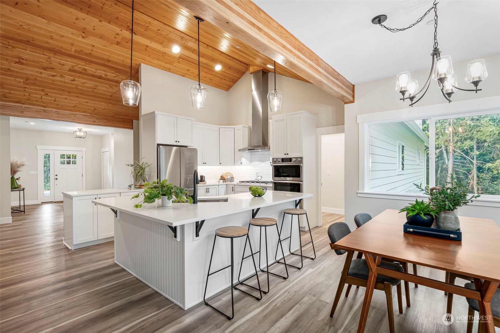 22086 Dewberry Road Northeast Indianola, WA 98342 - Photo 12 of 40 a view of a dining room with furniture