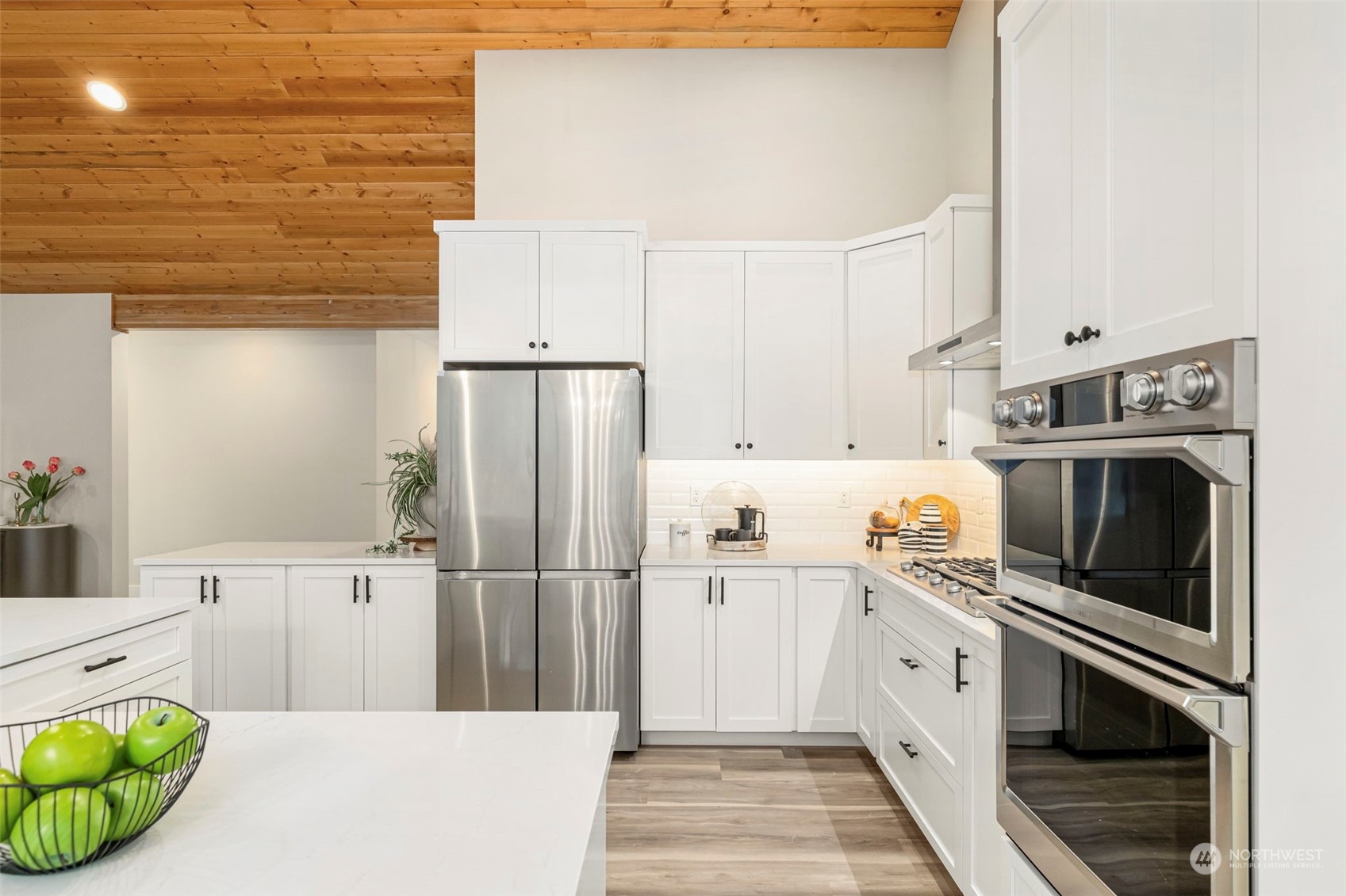 22086 Dewberry Road Northeast Indianola, WA 98342 - Photo 14 of 40 a kitchen with a sink a stove and refrigerator