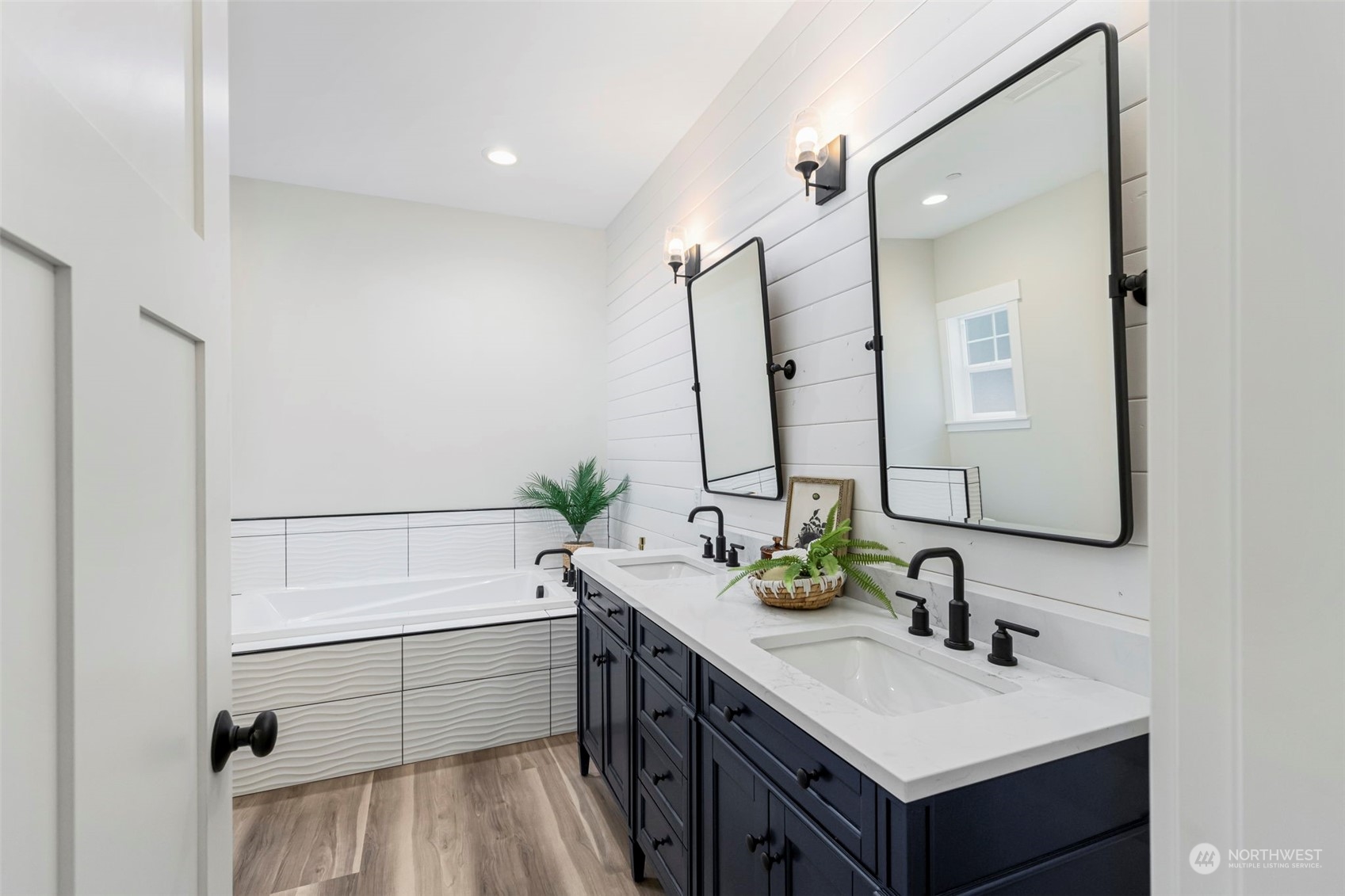 22086 Dewberry Road Northeast Indianola, WA 98342 - Photo 19 of 40 a bathroom with a sink and a mirror