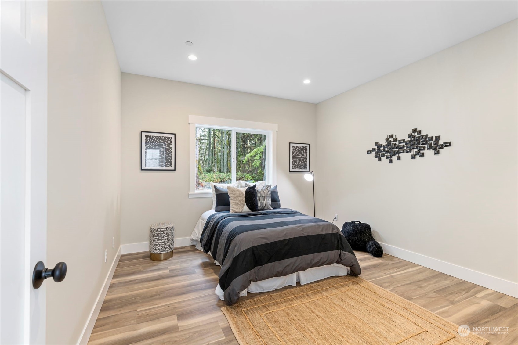 22086 Dewberry Road Northeast Indianola, WA 98342 - Photo 24 of 40 a bedroom with a bed and a window