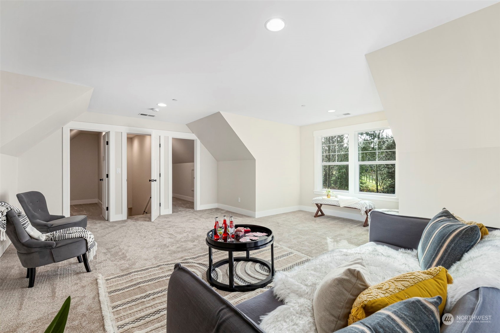 22086 Dewberry Road Northeast Indianola, WA 98342 - Photo 27 of 40 a living room with furniture and a large window