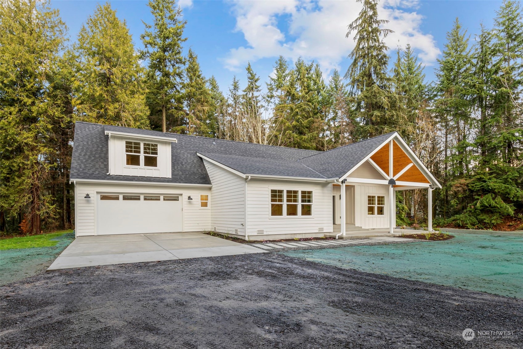 22086 Dewberry Road Northeast Indianola, WA 98342 - Photo 3 of 40 front view of a house with a yard