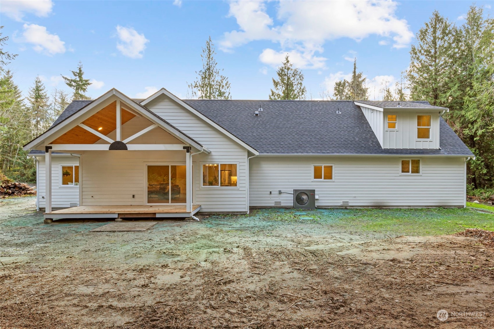 22086 Dewberry Road Northeast Indianola, WA 98342 - Photo 31 of 40 a view of a house with a yard