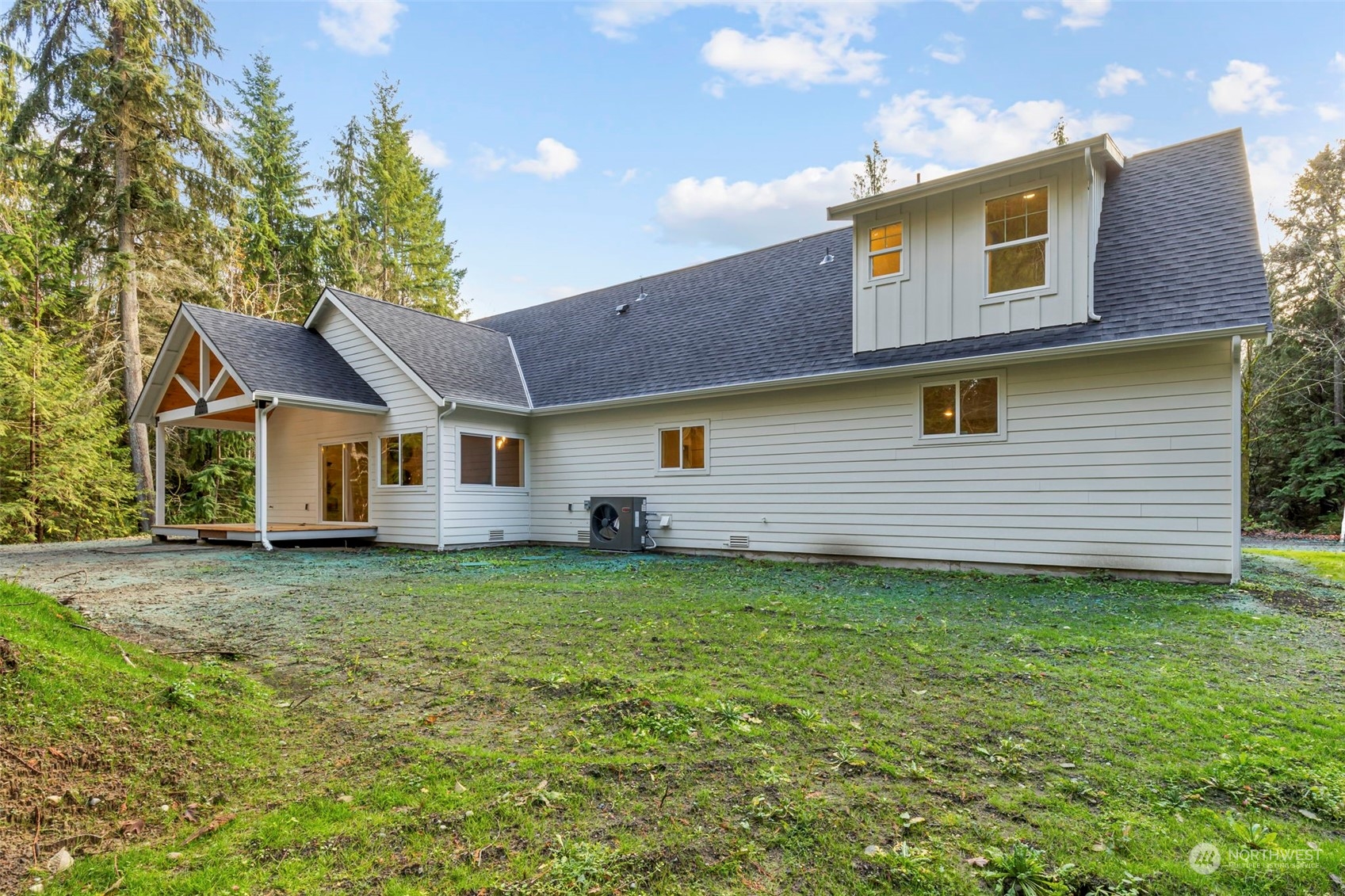 22086 Dewberry Road Northeast Indianola, WA 98342 - Photo 32 of 40 a front view of a house with a yard