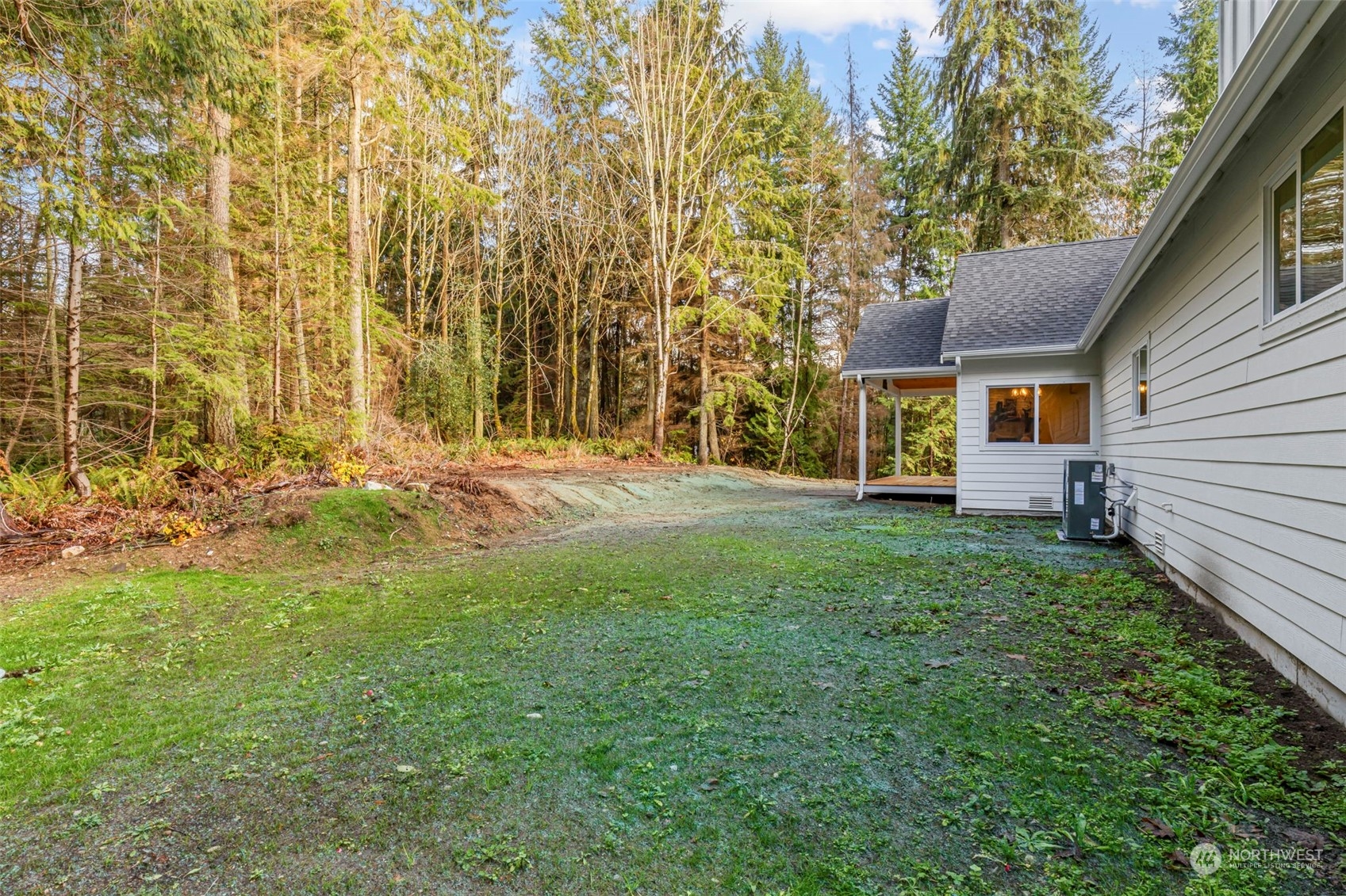 22086 Dewberry Road Northeast Indianola, WA 98342 - Photo 33 of 40 a front view of a house with a yard