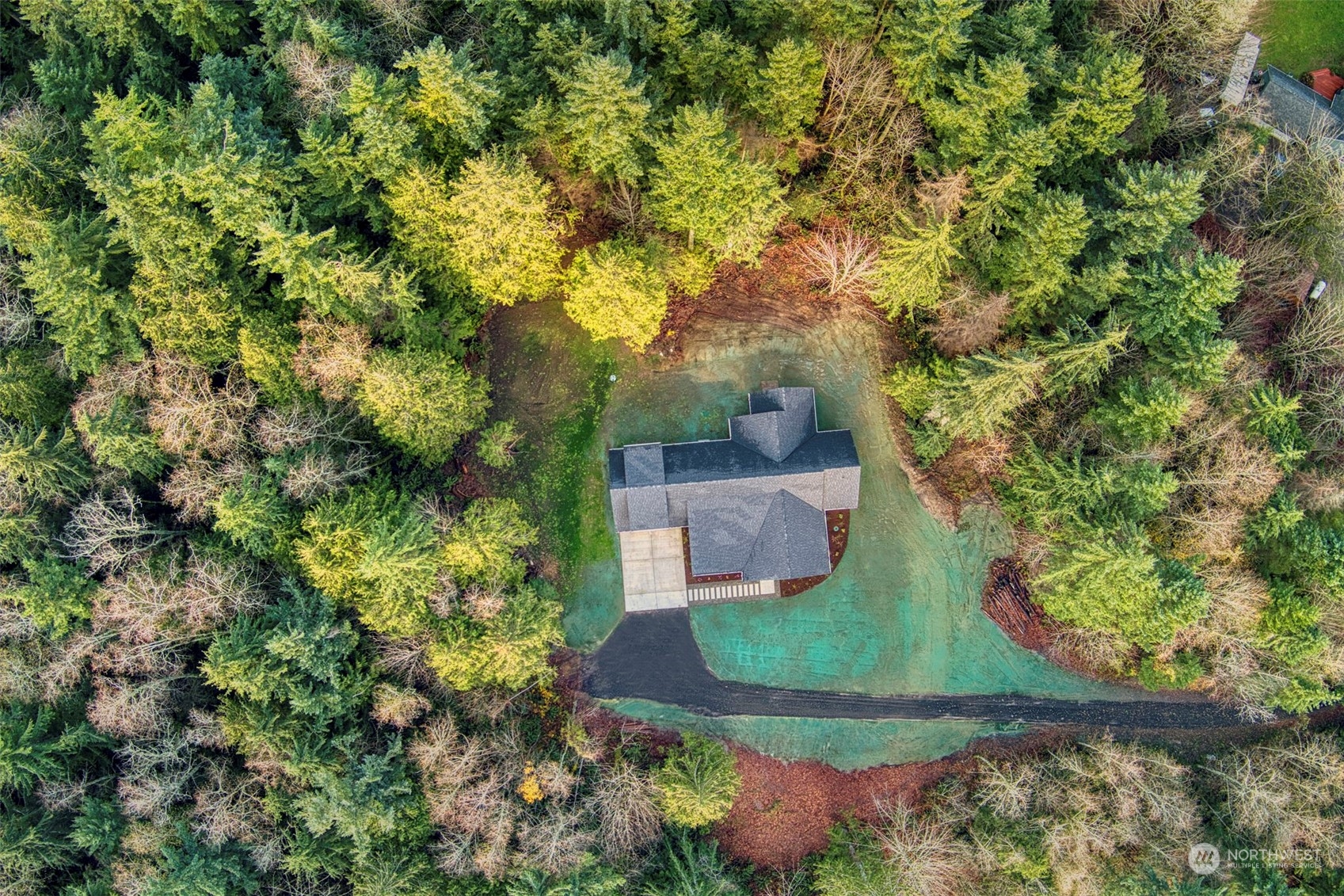 22086 Dewberry Road Northeast Indianola, WA 98342 - Photo 35 of 40 an aerial view of a house with a yard