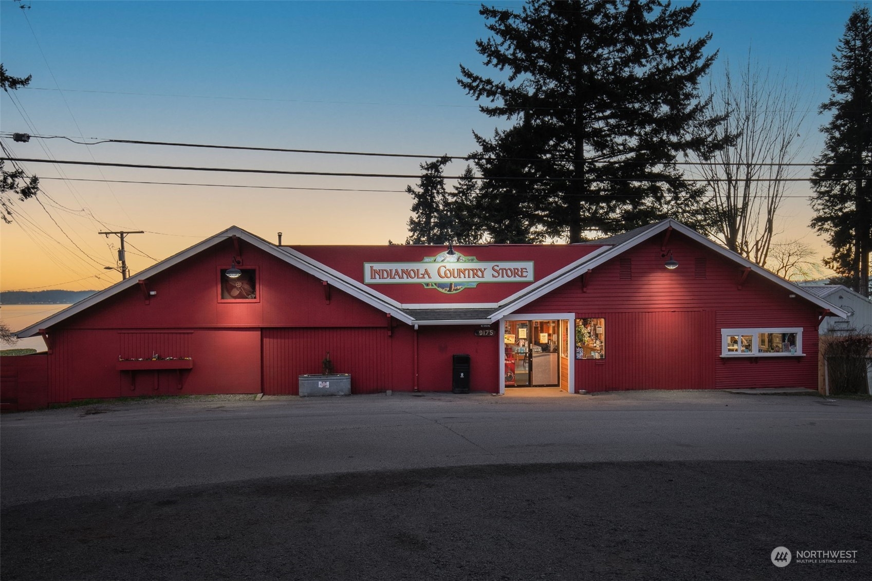 22086 Dewberry Road Northeast Indianola, WA 98342 - Photo 37 of 40 a front view of a house with a street