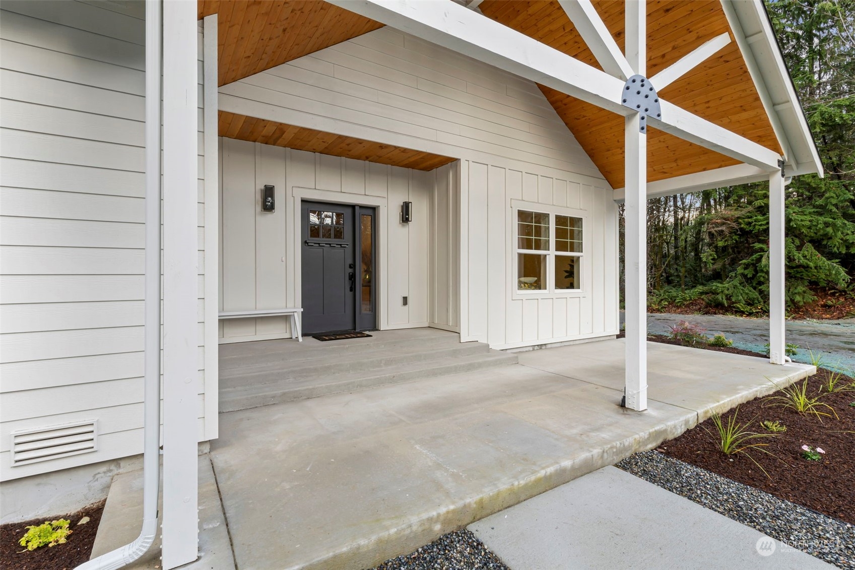 22086 Dewberry Road Northeast Indianola, WA 98342 - Photo 4 of 40 a porch with seating space
