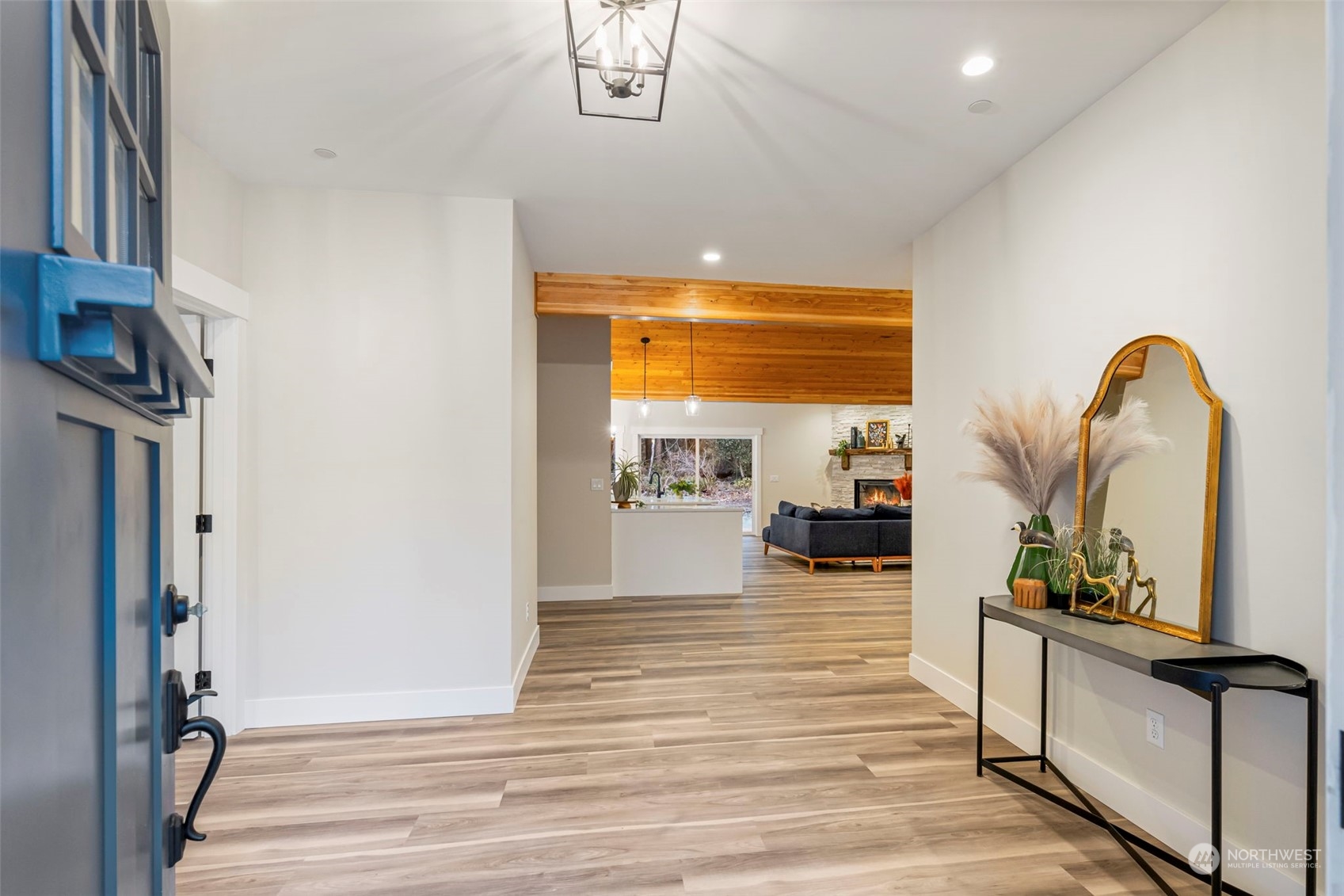 22086 Dewberry Road Northeast Indianola, WA 98342 - Photo 5 of 40 a view of a living room with furniture and a fireplace