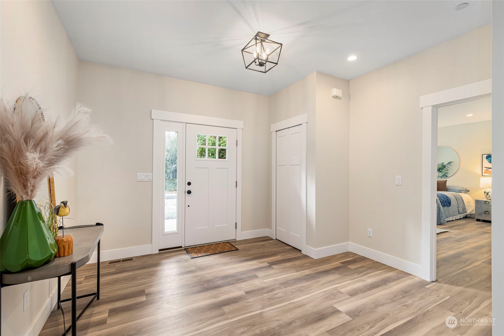 22086 Dewberry Road Northeast Indianola, WA 98342 - Photo 6 of 40 a view of a livingroom with wooden floor and a bookshelf